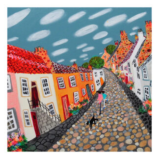 A colorful painting of a quaint cobblestone street lined with vibrant houses and two figures walking, under a stylized sky with clouds. By Nikki Monaghan