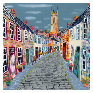 A colorful, stylized painting of a quaint village street with cobblestones, vibrant houses, and a prominent church tower in the background.By Nikki Monaghan