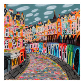 The image depicts a colorful, stylized painting of a town with buildings, a bridge, and a cobblestone road under a cloudy sky. By Nikki Monaghan