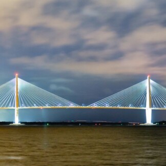 Illuminated suspension bridge in Charleston, SC at night