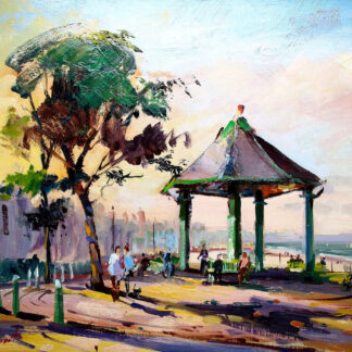 The image is a colorful impressionistic painting of a lively park scene with people, trees, a gazebo, and a view of the sea in the background. By Joseph Maxwell Stuart