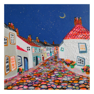 A colorful, whimsical painting of a cobblestone street at night lined with quaint houses under a starry sky with a crescent moon. By Nikki Monaghan