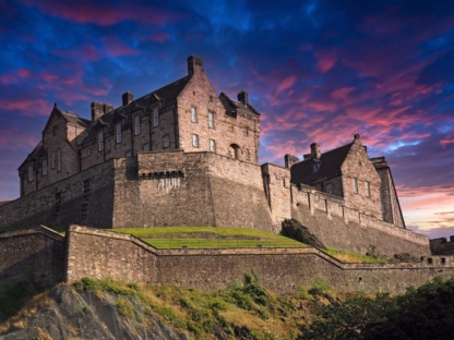 Framed photograph of Edinburgh Castle silhouetted against a vibrant evening sky with dramatic colours