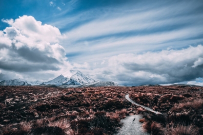 "The Long Road to Mordor print showcasing Scotland’s rugged landscape with a winding path leading into the distance under dramatic skies."